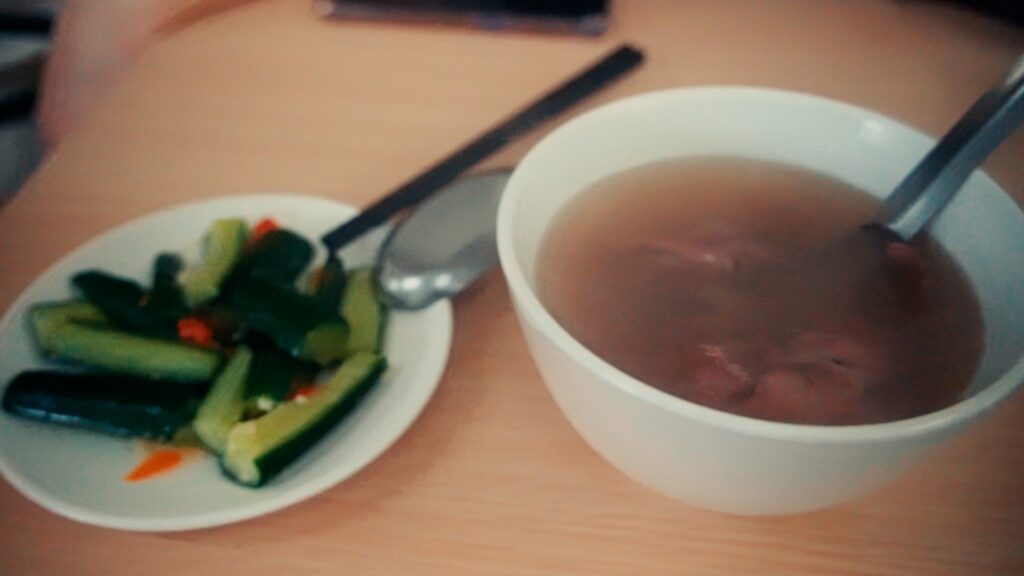 Hao Niu Beef Soup. Steaming bowl of traditional Tainan beef soup with tender slices of fresh beef"