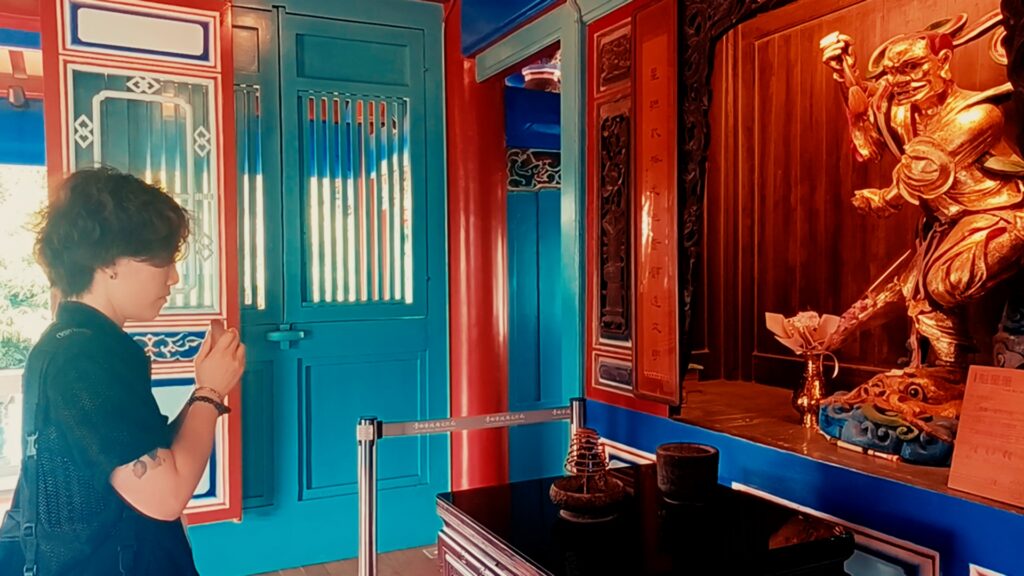 Praying at the Kuixing shrine inside Chihkan Tower for academic success