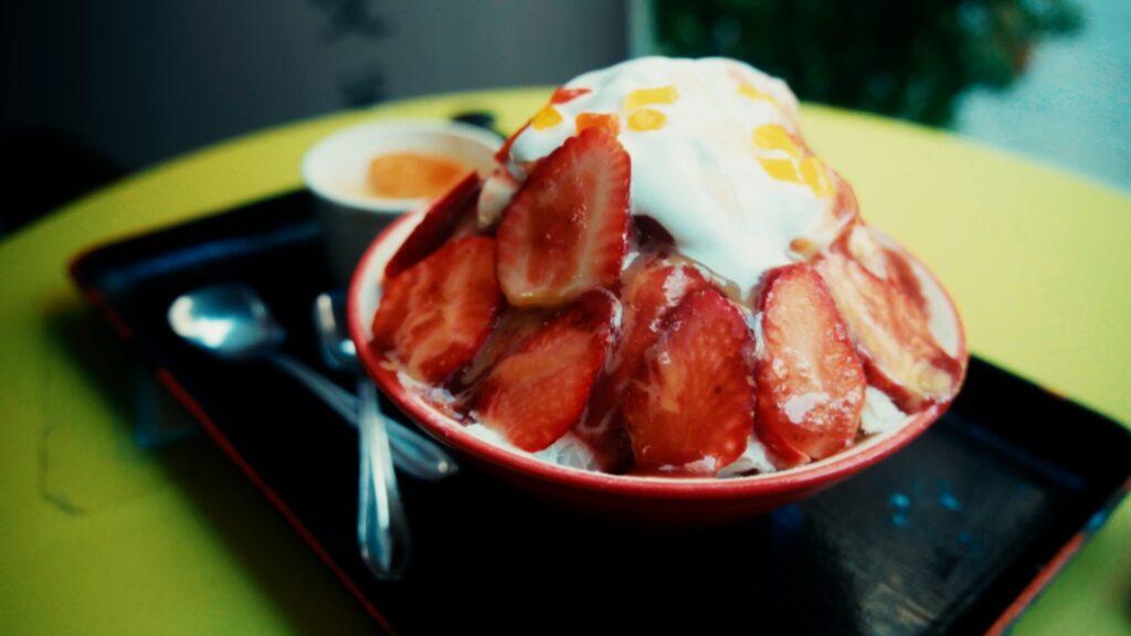 Large bowl of colorful shaved ice dessert at O'smooth ice shop in Tainan
